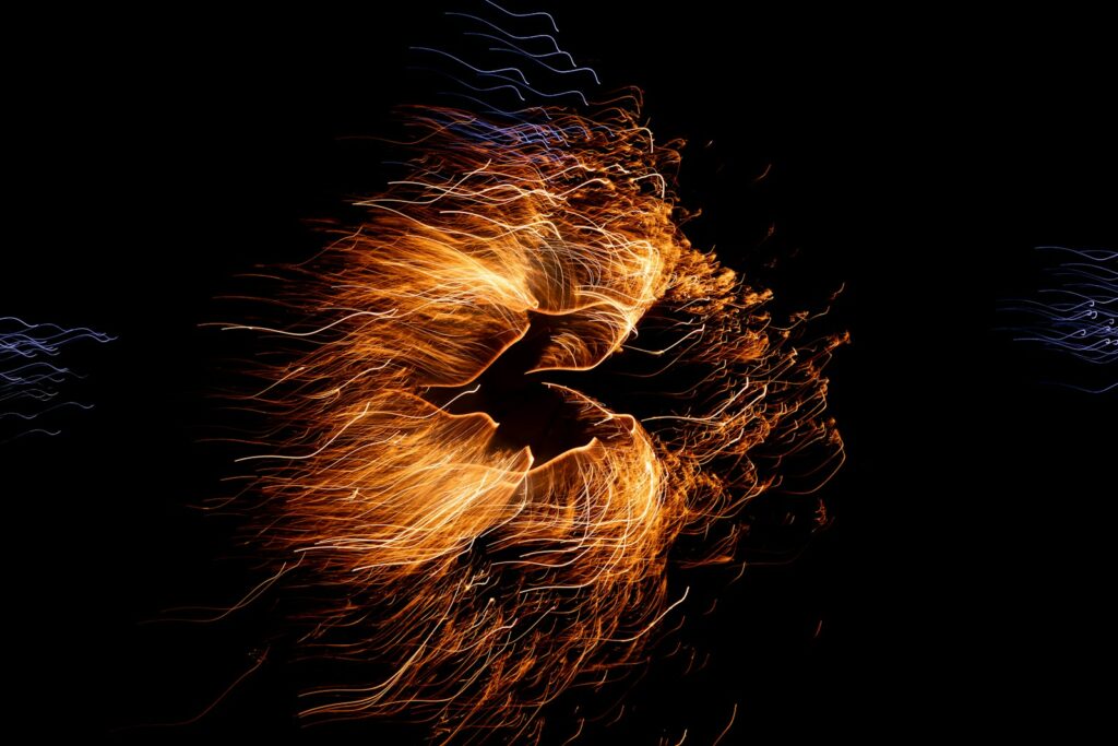 Vibrant fireworks burst against a black sky.