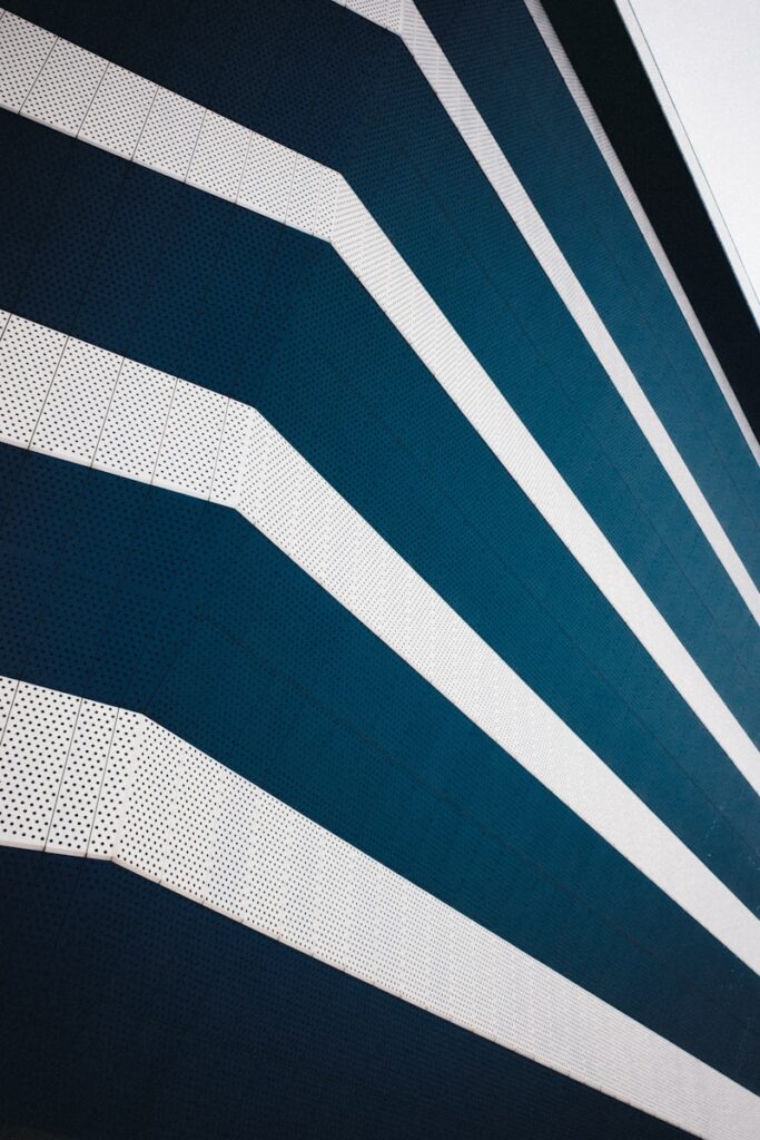 Diagonal lines of blue and white create a pattern.